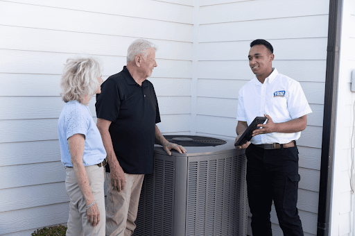 YES! technician helping a couple with air conditioning installation at their Salt Lake City, UT, home.