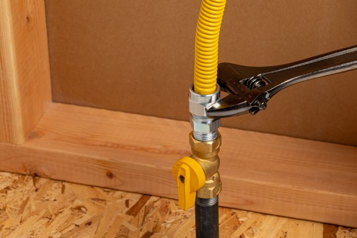 Wrench twisting bolt on newly installed gas line in a Las Vegas, NV, home.